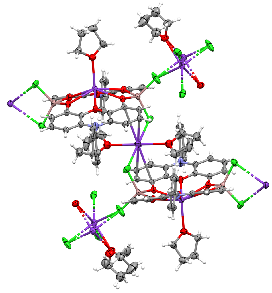 a molecular structure of a molecule viewed as a series of balls and sticks. The compound is a polymeric interlinked structure of phenoxazines and potassium cations.